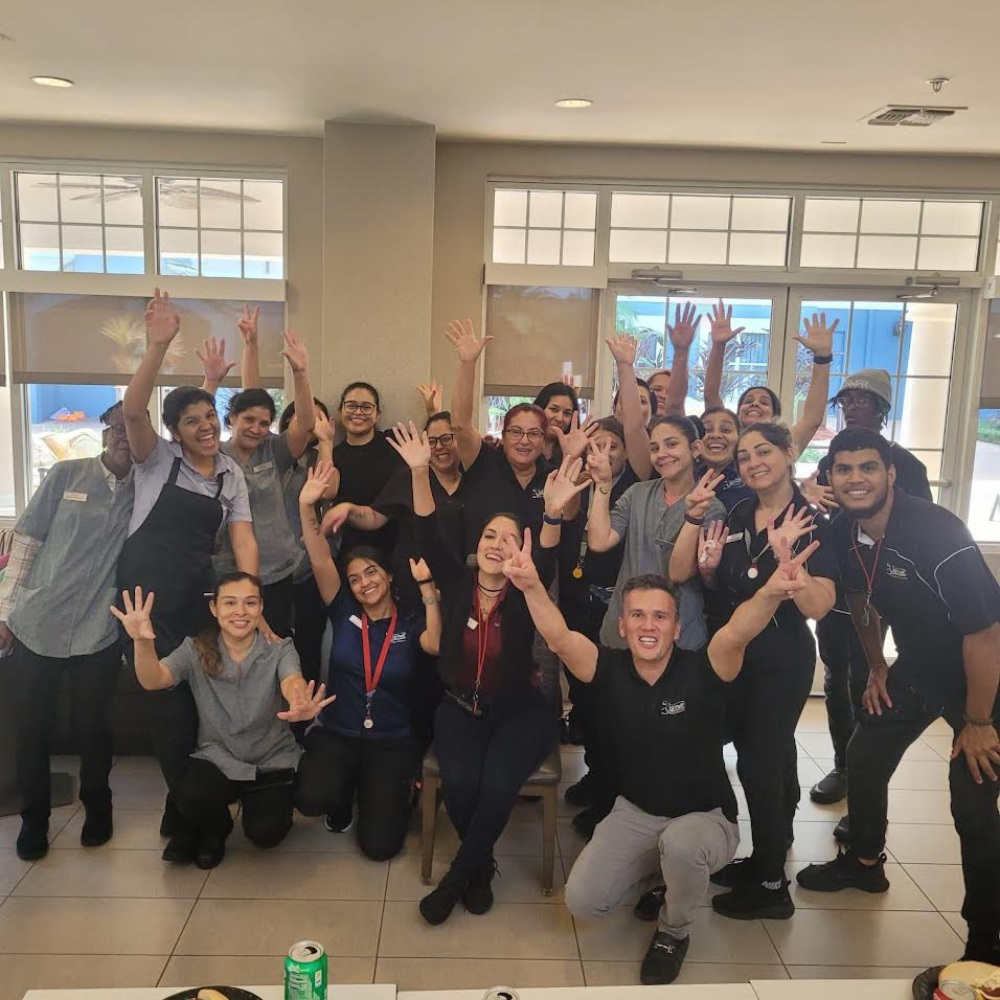 Staffing team poses celebrating in Kissimmee, FL